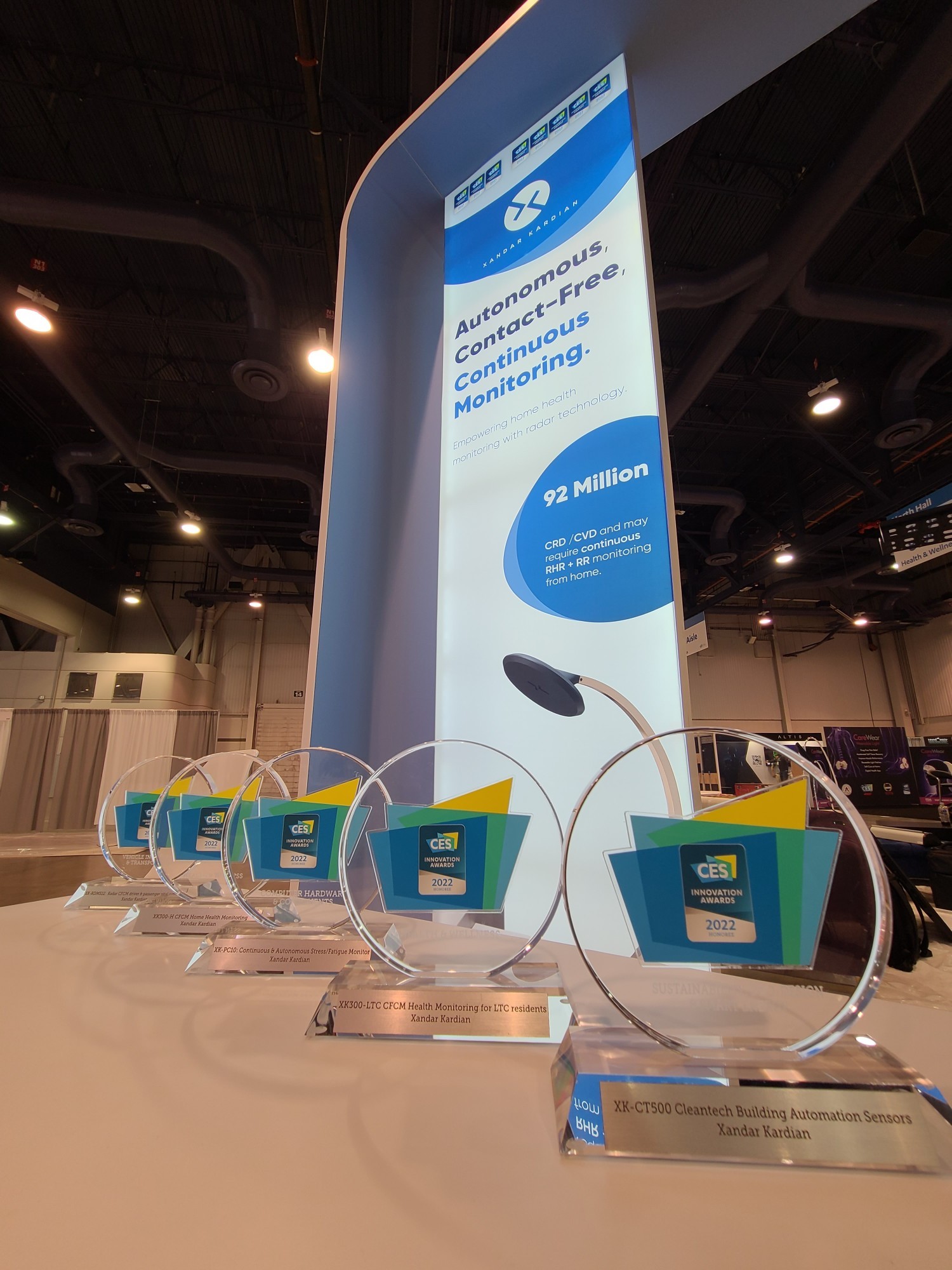 Five CES Innovation Award trophies on the stand