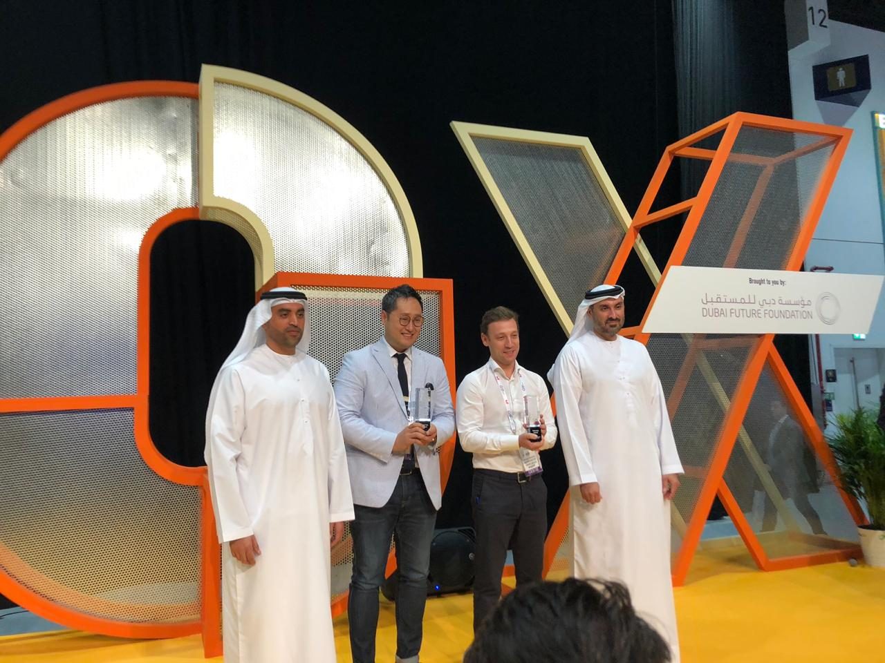 Receiving an award on stage at the Dubai Future Foundation